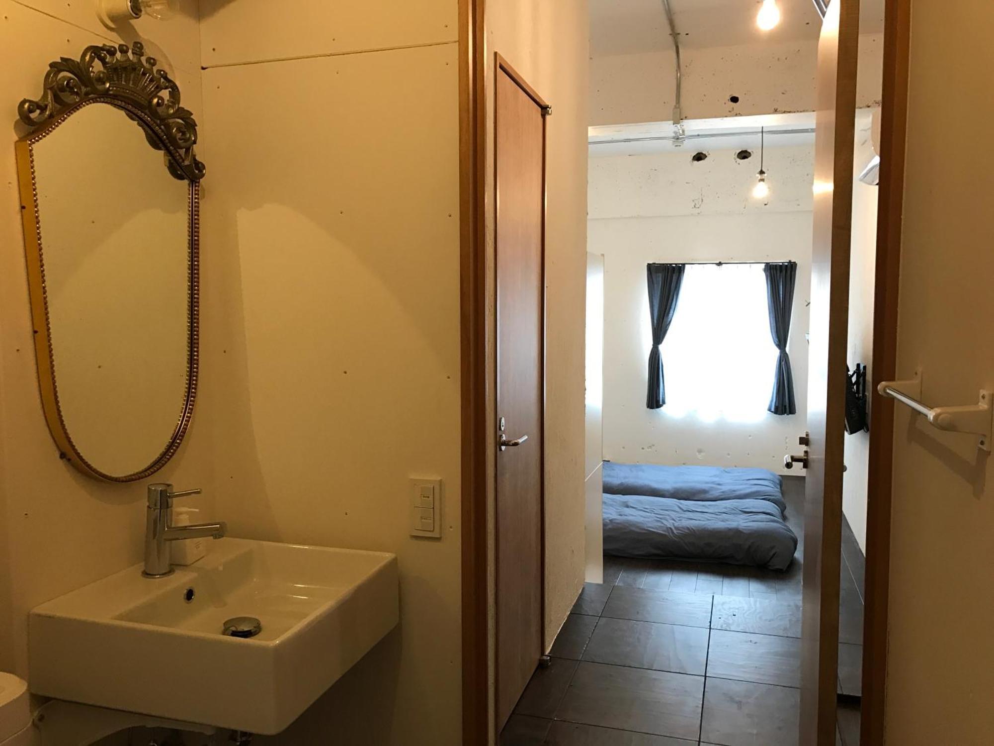Guest House Golden Mile Hostel Amami Esterno foto