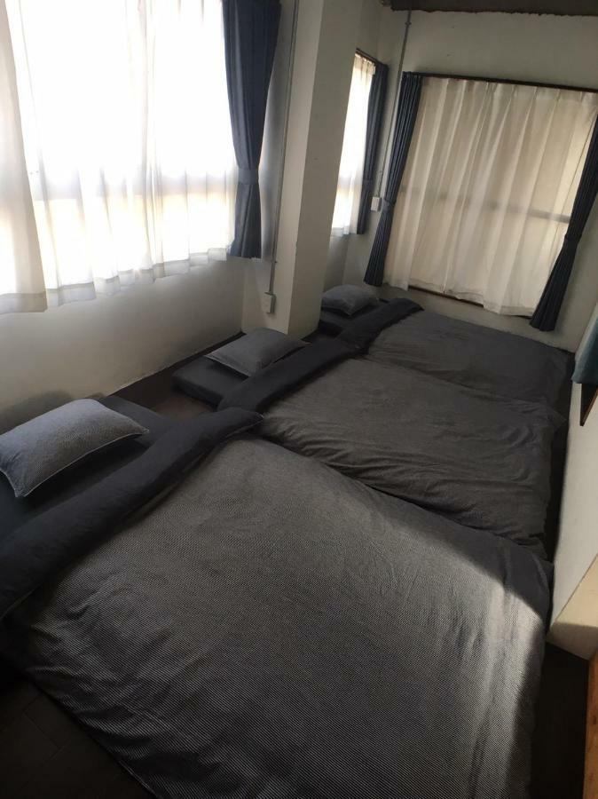 Guest House Golden Mile Hostel Amami Esterno foto