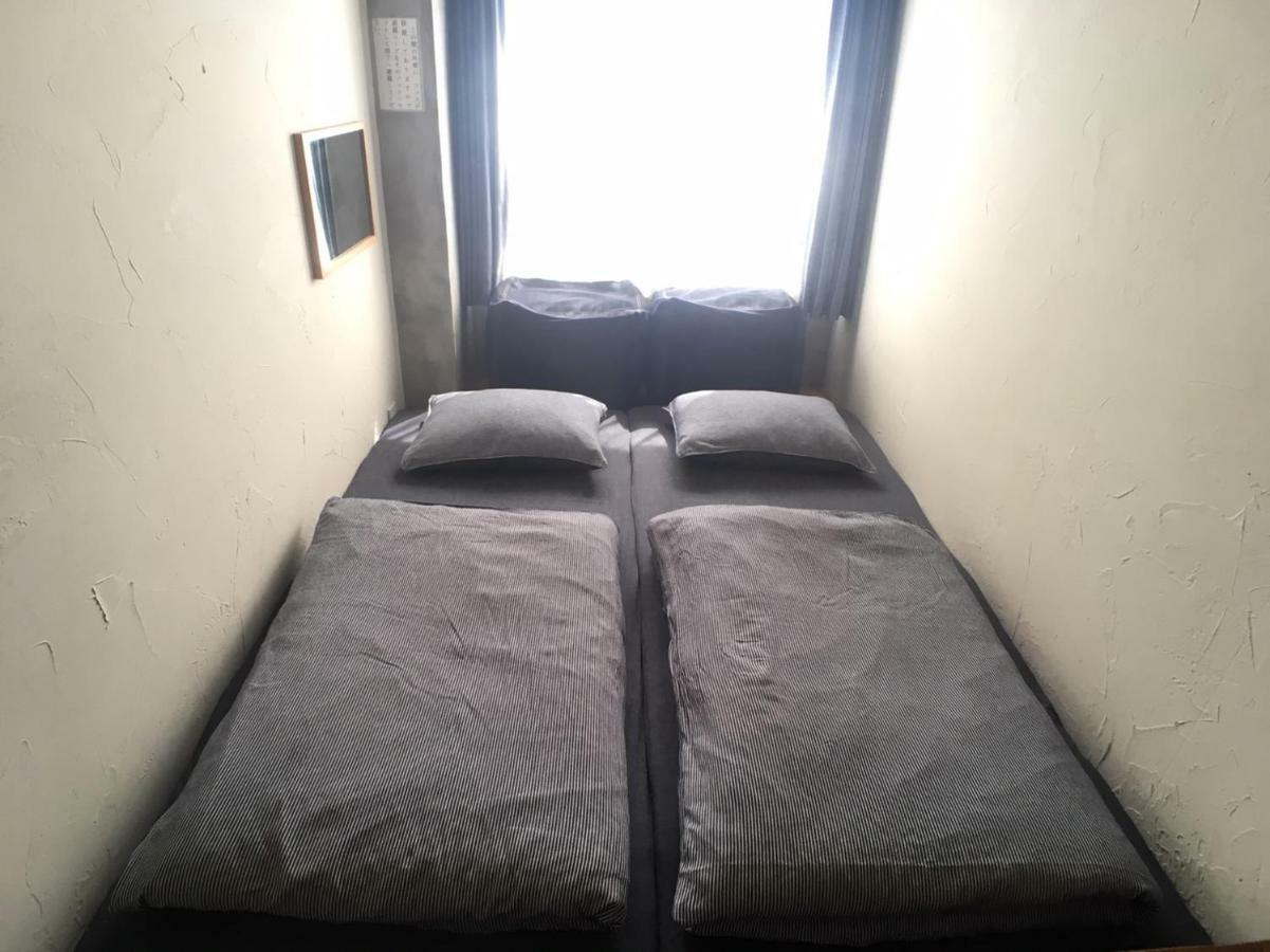 Guest House Golden Mile Hostel Amami Camera foto
