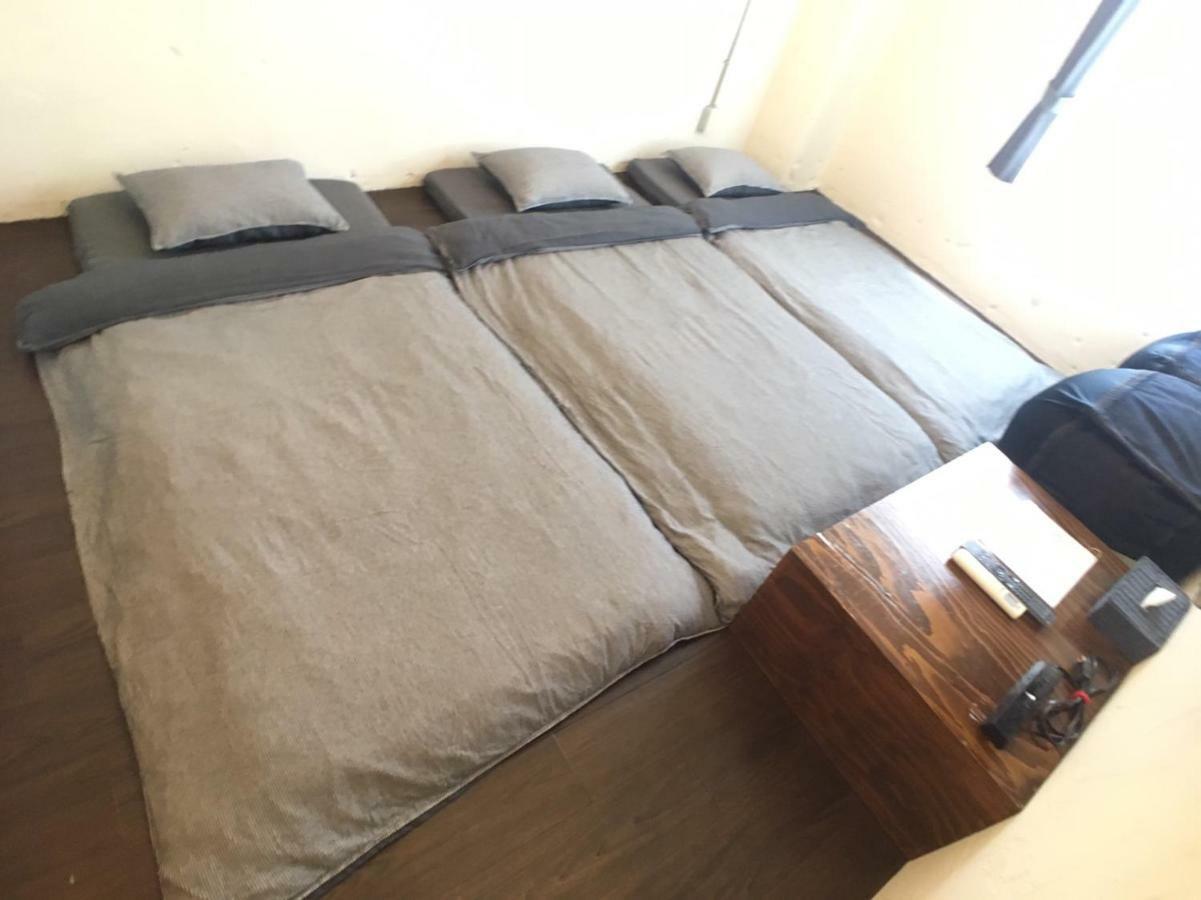 Guest House Golden Mile Hostel Amami Esterno foto