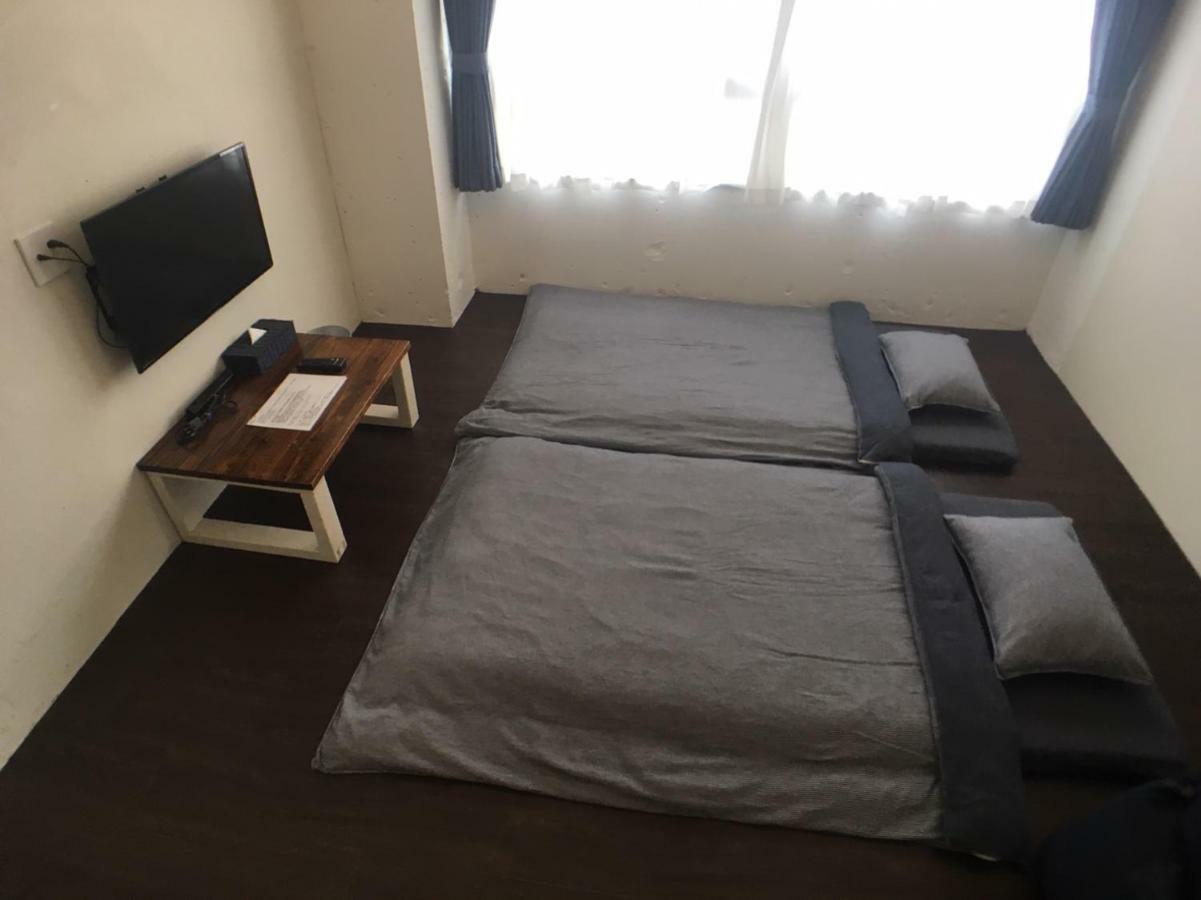 Guest House Golden Mile Hostel Amami Esterno foto